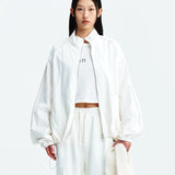 MATIN KIM 2603 LOGO COATING JUMPER IN WHITE