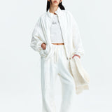 MATIN KIM 2603 LOGO COATING JUMPER IN WHITE